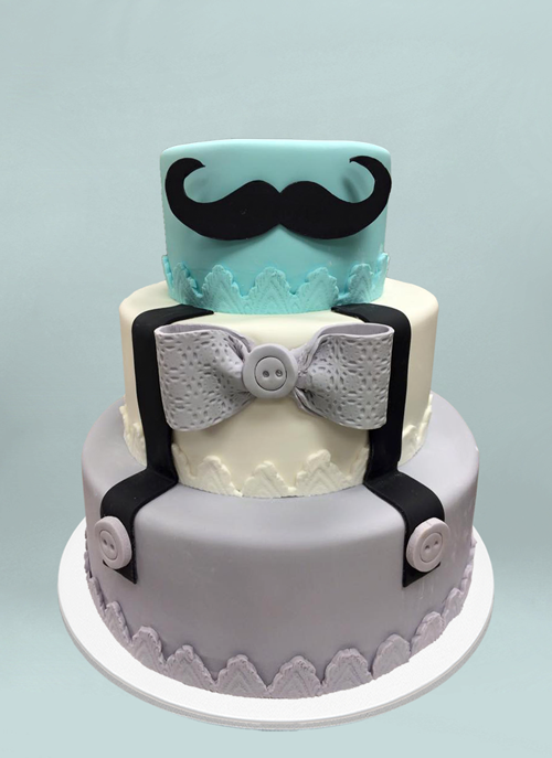 Photo: fondant cake with giant mustache and suspenders