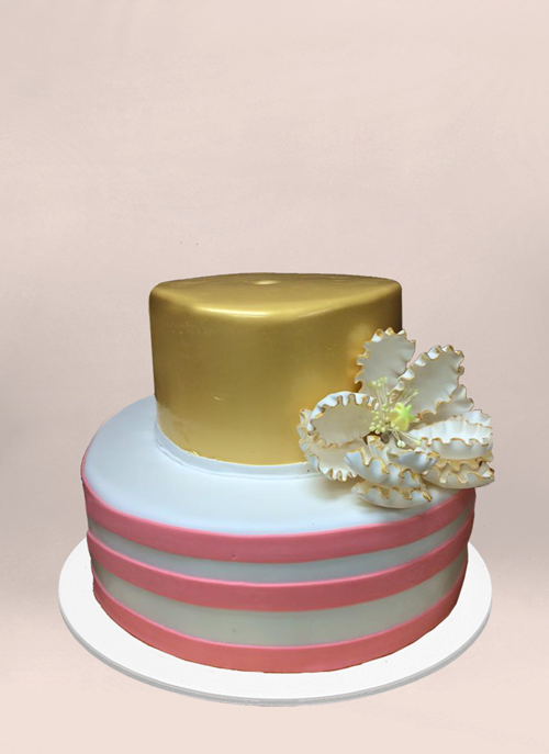 Photo: fondant cake, pink and white stripe, solid gold tier with large sugar flower
