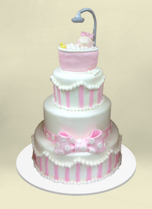 Photo: 4 tier pink and white fondant cake with bubbly tub, shower on top