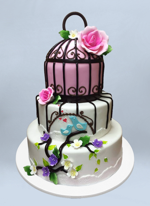 Photo: fondant cake with forsted bird cage pattern and sugar flowers