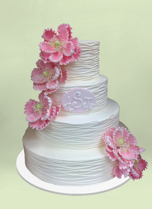 Photo: 4 tier white forsted pattern cake with pink sugar flowers