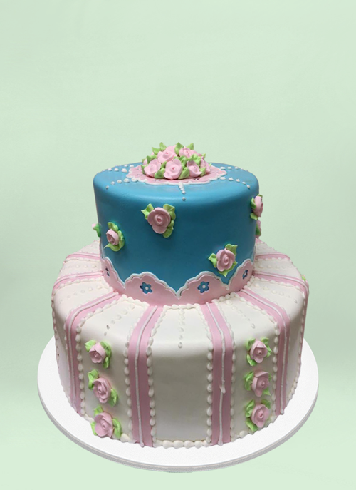 Photo: 2 tier fondant cake with small frosted flowers and patterns