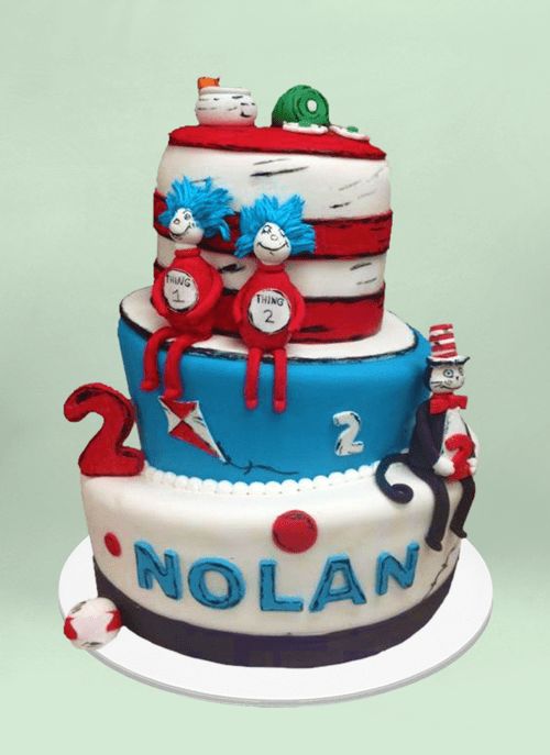 Photo: fondant cake with dr. suess characters sitting around the tiers