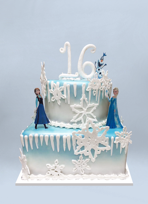 Photo: square blue to white tiers with large fondant snowflakes, icicles and standing characters from Frozen
