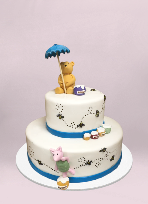 Photo: 2 tier winne the poph cake with bees and honey pattern