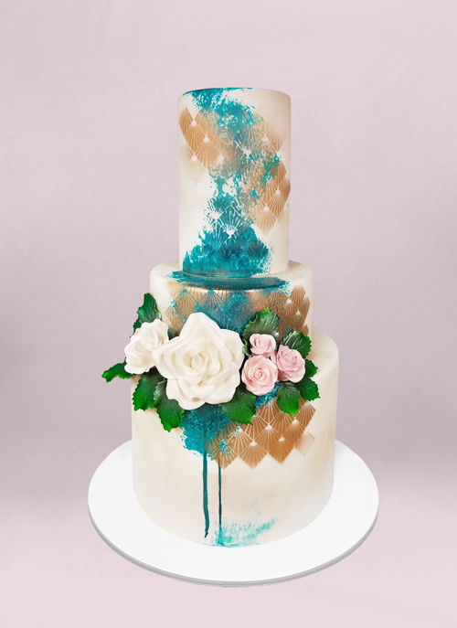 Photo: smooth white cake with painted shapes sugar flowers