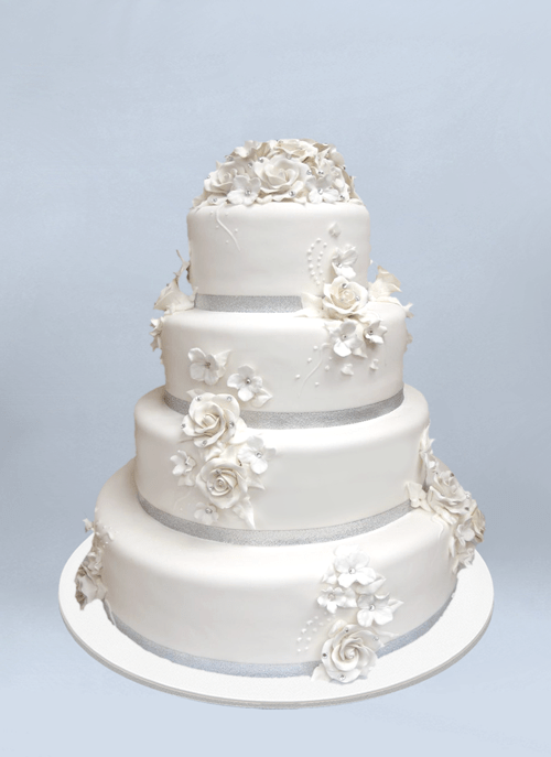 Photo: white fondant cake covered in white fondant flowers