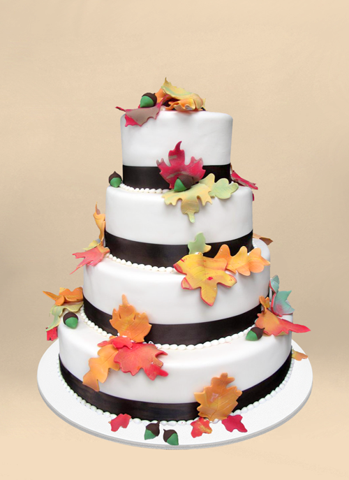 Photo: fall cake, white fondant covered in leaves and acorns