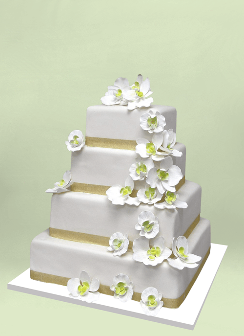 Photo: four squre tiers with small white flowers, green centers