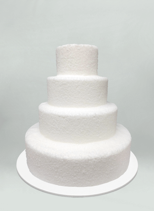 Photo: four tiers of snowball textured white cake