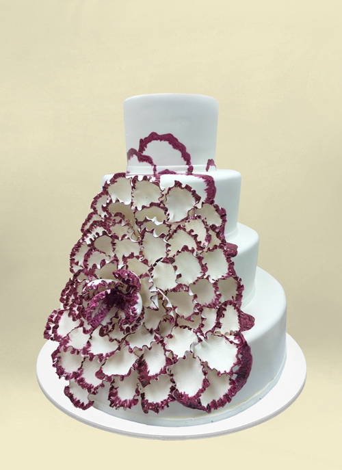 Photo: white fondant cake with dimensional cascading purple edged flower
