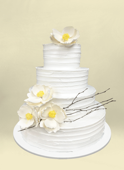 Photo: smooth white cake with large white sugar flowers